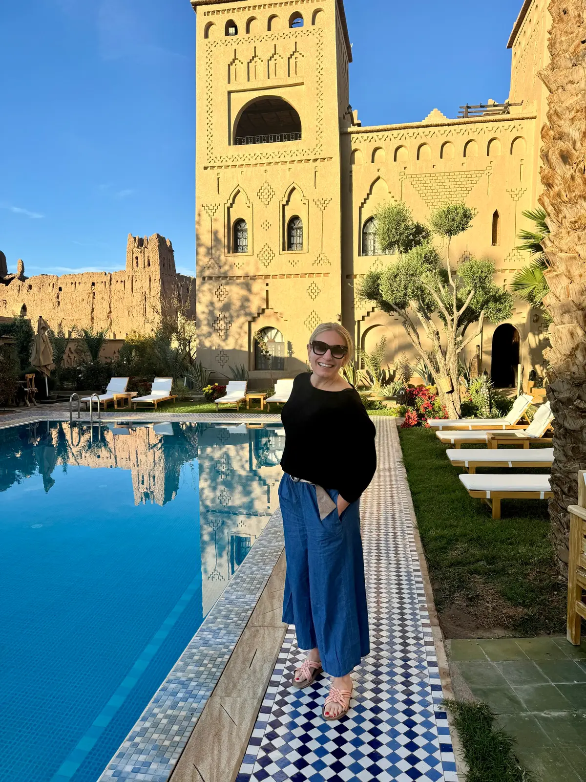 Julie Hartigan at a kasbah hotel pool in Morocco
