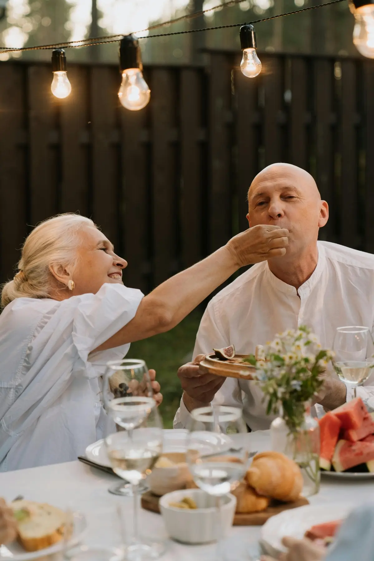 Two friends eating and smiling