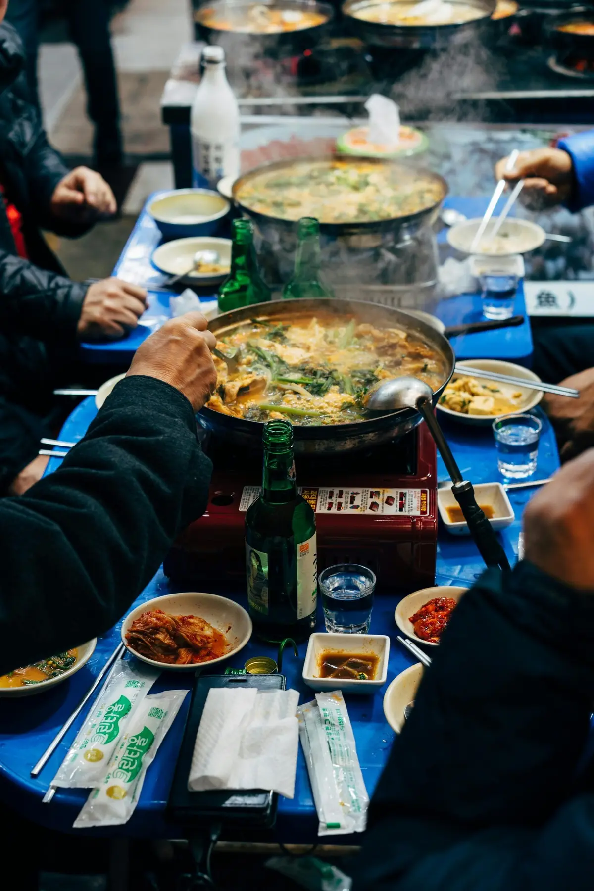 Friends sharing a Korean hot pot dinner