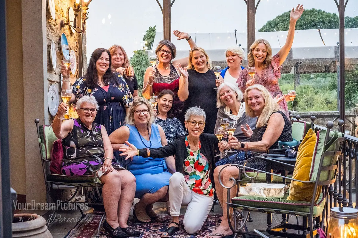 Julie Hartigan and friends with drinks at il Falconiere